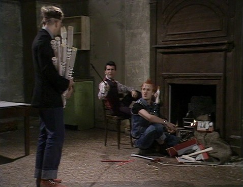 Screengrab from Young Ones episode Cash, showing fire