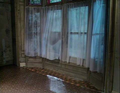 Screenshot from Young Ones episode Cash, showing window