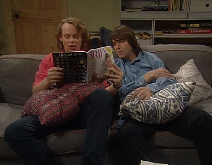 Gary and Tony, with cushions hiding their BIG ERECTIONS