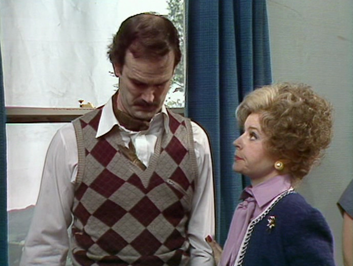 Basil Fawlty with a kipper in his jacket