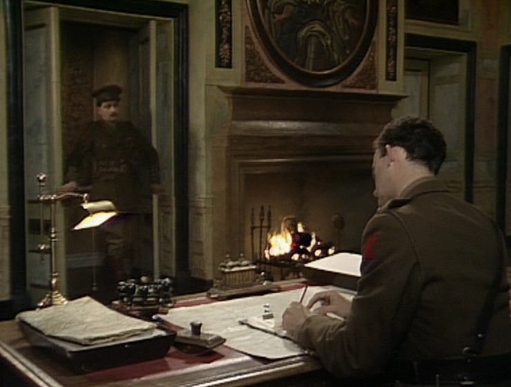 Blackadder and Darling in Melchett's office. Fireplace and circular portrait visible.