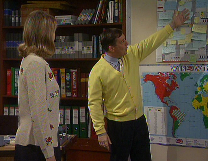 George pointing out his wall planner