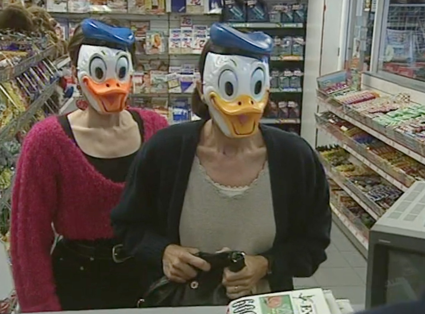 Bill in a Donald Duck mask accidentally robbing a petrol station