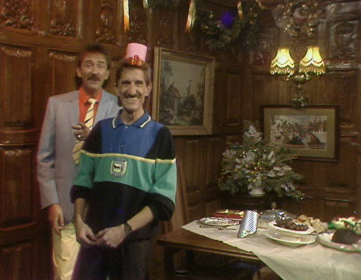The Chuckle Brothers with wood panelling in the background