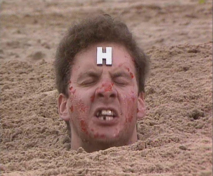 Close-up of Rimmer, annoyed