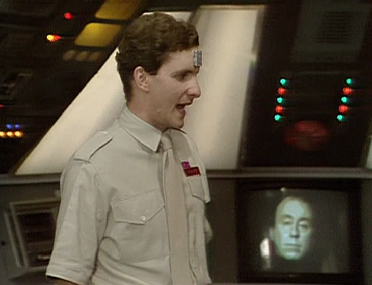 Rimmer in the Drive Room with Holly in the background