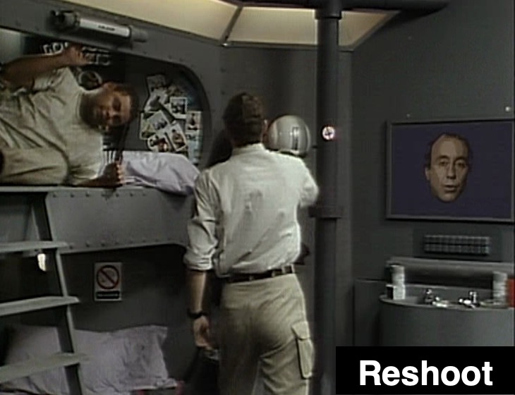 Rimmer and Lister in the bunkroom with Holly on the monitor