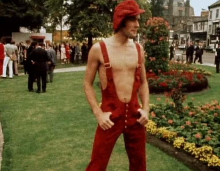 Guy in revealing red suspenders and trousers