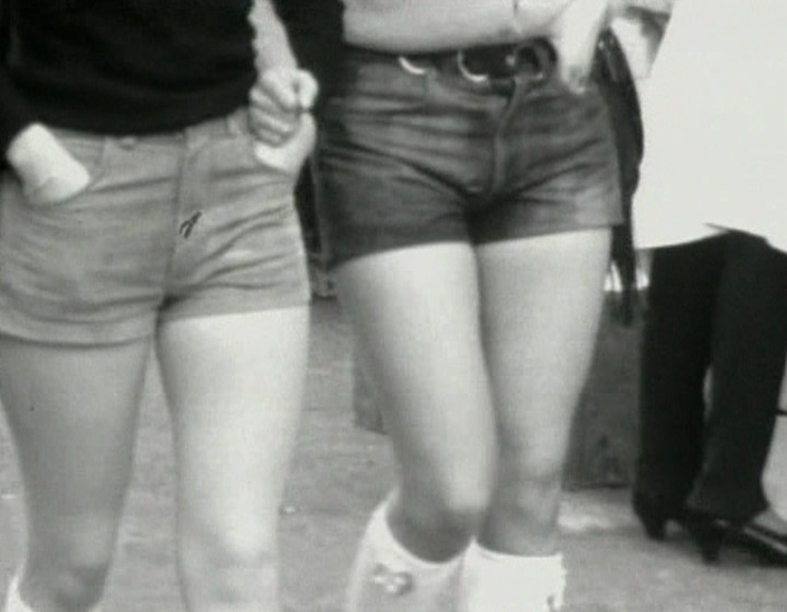 Black and white: two women wearing shorts