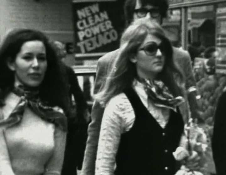 Two women walking down the street