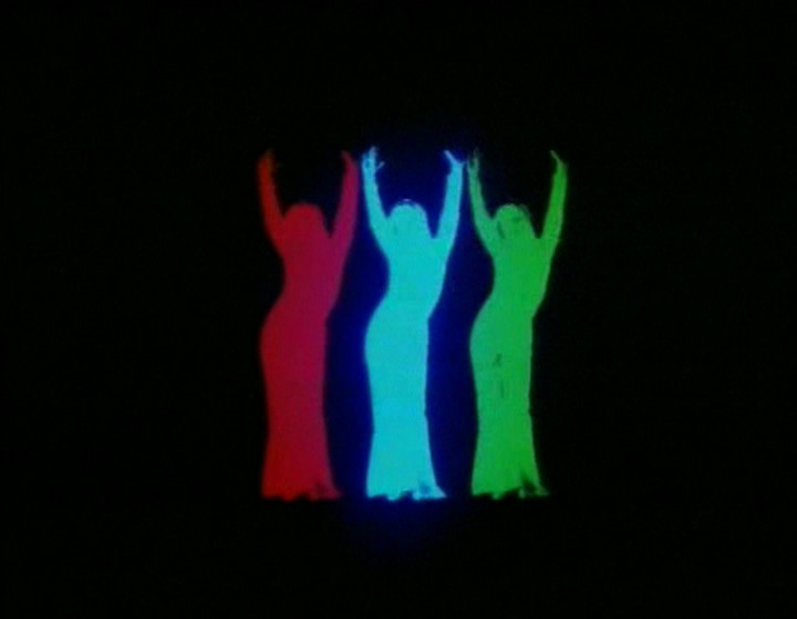 Three girls dancing, red/blue/green