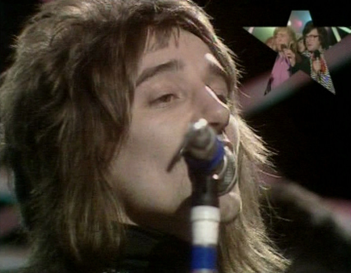 Close-up of Rod Stewart with Smashie and Nicey in the corner