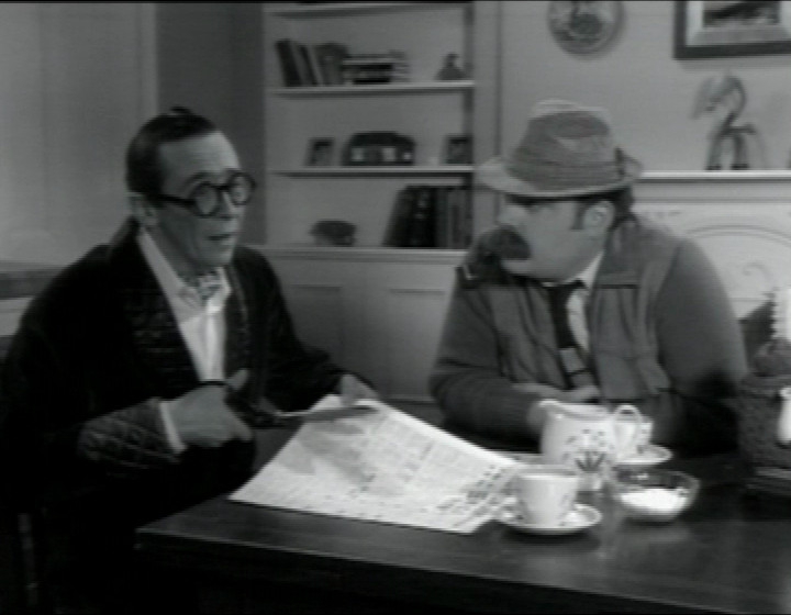 Paul Whitehouse as Arthur, and John Thomson as Chester, sitting a the kitchen table in a black and white studio sitcom