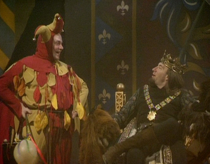 Charlie Higson as the jester, and Simon Day as the King, in the throne room