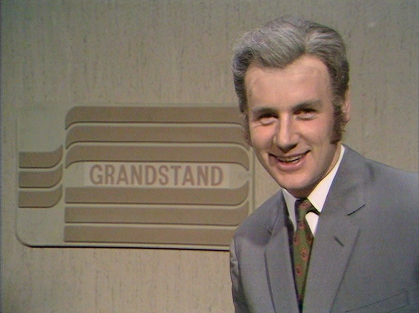  Michael Palin as Frank Bough looking very amused at Eric Idle's dirty joke